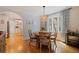 Inviting dining room with wood table, pendant light, and views into the kitchen at 3512 W Santiago St, Tampa, FL 33629