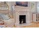 Close-up of a white brick fireplace with marble hearth and decorative accents at 3512 W Santiago St, Tampa, FL 33629