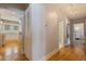 Hallway with hardwood floors leading to the kitchen and bathroom at 3512 W Santiago St, Tampa, FL 33629