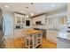 Bright, updated kitchen with white cabinets, stainless steel appliances, and a butcher block island at 3512 W Santiago St, Tampa, FL 33629