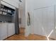 Functional laundry area with washer, dryer, shelving, and closet space at 3512 W Santiago St, Tampa, FL 33629