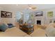 Cozy living room with hardwood floors, fireplace, and comfortable seating at 3512 W Santiago St, Tampa, FL 33629