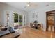 Home office with hardwood floors and glass doors to the backyard at 3512 W Santiago St, Tampa, FL 33629