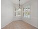 Dining Room area has neutral colored tile and lots of natural light at 4301 Ridgemoor N Dr, Palm Harbor, FL 34685