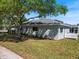 Lovely single-story home with a well-maintained yard and white picket fence at 4301 Ridgemoor N Dr, Palm Harbor, FL 34685