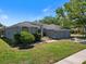 Charming single-story home with a well-maintained lawn and a three-car garage at 4301 Ridgemoor N Dr, Palm Harbor, FL 34685