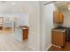 Convenient laundry room with wooden cabinets, granite countertops, and modern washer/dryer units at 4301 Ridgemoor N Dr, Palm Harbor, FL 34685