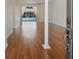 Bright, open living area showcasing laminate flooring and a view of the outdoor pool at 4301 Ridgemoor N Dr, Palm Harbor, FL 34685