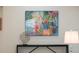 Stylish console table adorned with modern art and a decorative sculpture at 4530 5Th S Ave, St Petersburg, FL 33711