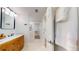 The bathroom features a wood vanity, marble countertop, unique lighting, and tiled floors at 4530 5Th S Ave, St Petersburg, FL 33711