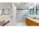 Modern bathroom with glass enclosed shower and double vanity for shared use at 4530 5Th S Ave, St Petersburg, FL 33711