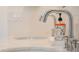 Close up of a faucet with bright modern counters and decor in the background at 4530 5Th S Ave, St Petersburg, FL 33711