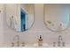 Bathroom featuring dual sinks, stylish fixtures, and modern mirrors at 4530 5Th S Ave, St Petersburg, FL 33711