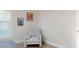 Bedroom featuring bright walls, a chair, and decorative wall art at 4530 5Th S Ave, St Petersburg, FL 33711