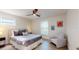 Cozy bedroom with a ceiling fan, neutral bedding, and bright windows at 4530 5Th S Ave, St Petersburg, FL 33711