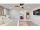 Bright bedroom boasts a ceiling fan, modern recessed lighting, and an en suite bathroom at 4530 5Th S Ave, St Petersburg, FL 33711