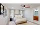 This neutral toned bedroom is illuminated by recessed lights, ceiling fan, and natural light at 4530 5Th S Ave, St Petersburg, FL 33711