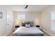 Bedroom with a plush bed, bright windows, and hardwood floors at 4530 5Th S Ave, St Petersburg, FL 33711