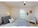 Bedroom features comfortable bed, accent pillows, and side chair at 4530 5Th S Ave, St Petersburg, FL 33711