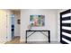 Entryway with modern console table, art, and a view into the bedroom at 4530 5Th S Ave, St Petersburg, FL 33711