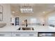 Open kitchen view with stainless steel appliances and a clear view of the living area at 4530 5Th S Ave, St Petersburg, FL 33711