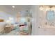 Bright living room featuring a stylish, large sectional couch and colorful, patterned area rug at 4530 5Th S Ave, St Petersburg, FL 33711