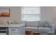 Bright living room featuring a plush white sofa, stylish throw pillows, and natural light at 4530 5Th S Ave, St Petersburg, FL 33711