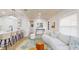 Open-concept living area with modern lighting, breakfast bar, and a comfortable seating area at 4530 5Th S Ave, St Petersburg, FL 33711