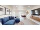Open-concept living area featuring a large sectional sofa and dining table at 4530 5Th S Ave, St Petersburg, FL 33711