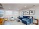 Cozy living room with a plush blue sectional sofa, stylish decor, and bright windows at 4530 5Th S Ave, St Petersburg, FL 33711
