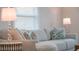 Close-up of a bright living room sofa with decorative pillows and stylish side tables at 4530 5Th S Ave, St Petersburg, FL 33711