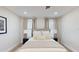 Relaxing bedroom featuring neutral decor, comfortable linens, and bedside lamps at 4530 5Th S Ave, St Petersburg, FL 33711