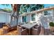 Outdoor dining area on backyard deck featuring a modern table and seating at 4530 5Th S Ave, St Petersburg, FL 33711