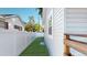 Side yard featuring a new privacy fence and well-maintained lawn at 4530 5Th S Ave, St Petersburg, FL 33711