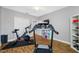Home exercise room with modern equipment including a treadmill and exercise bike at 4803 Longwater Way, Tampa, FL 33615