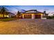 Beautiful home with a three-car garage and well-manicured lawn, providing excellent curb appeal at 4803 Longwater Way, Tampa, FL 33615