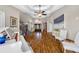 Bright and airy foyer showcasing a grand staircase, piano, and beautiful decor at 4803 Longwater Way, Tampa, FL 33615
