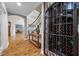 Elegant foyer featuring a wine cellar, wooden floors and staircase leading to upper level at 4803 Longwater Way, Tampa, FL 33615