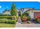Inviting front of home with meticulously landscaped walkway leading to the front door at 4803 Longwater Way, Tampa, FL 33615