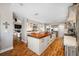 Gourmet kitchen with a large island, stainless steel appliances, and access to a cozy living room at 4803 Longwater Way, Tampa, FL 33615