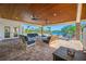 Spacious covered lanai with comfortable seating and stunning views of the waterfront at 4803 Longwater Way, Tampa, FL 33615