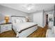 Spacious main bedroom with a king bed, ceiling fan, and access to a closet at 4803 Longwater Way, Tampa, FL 33615