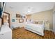 Tranquil main bedroom featuring patterned wallpaper, a ceiling fan, and a comfortable bed at 4803 Longwater Way, Tampa, FL 33615