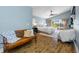 Serene main bedroom with water views, a comfortable bench, a king bed, and a ceiling fan at 4803 Longwater Way, Tampa, FL 33615