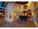 Elegant outdoor kitchen and patio area with a built-in grill, bar seating, and ample counter space at 4803 Longwater Way, Tampa, FL 33615