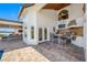 Outdoor kitchen and bar area with waterfront views at 4803 Longwater Way, Tampa, FL 33615