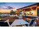 Outdoor patio offers a fire pit, dining area, covered space, and beautiful water views at 4803 Longwater Way, Tampa, FL 33615