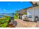 Outdoor area features a brick oven, grill, and waterfront views at 4803 Longwater Way, Tampa, FL 33615