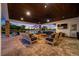 Spacious covered patio with a beautiful outdoor seating arrangement and stunning views of the tranquil waterfront at 4803 Longwater Way, Tampa, FL 33615