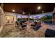 Covered patio with comfortable seating and scenic waterfront views, ideal for outdoor entertaining at 4803 Longwater Way, Tampa, FL 33615